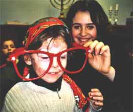 Inna helps Dominuque dress for Purim.